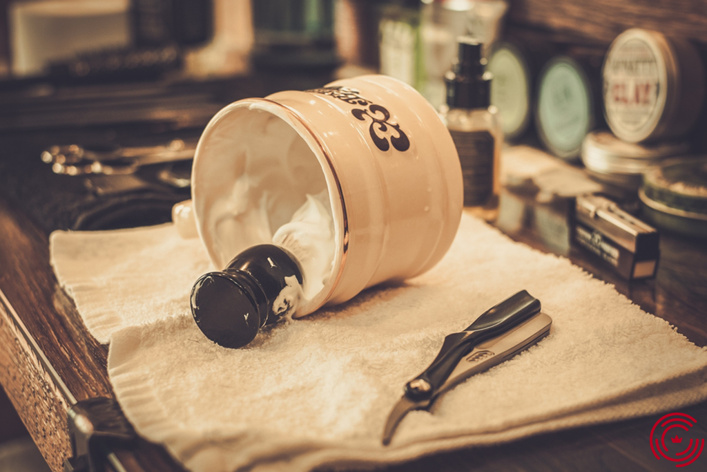 A shaving pad in a shaving foam container on a table